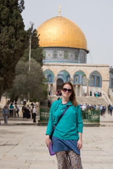Caitlin in front of the dome of the rock in her lent hoodie.
